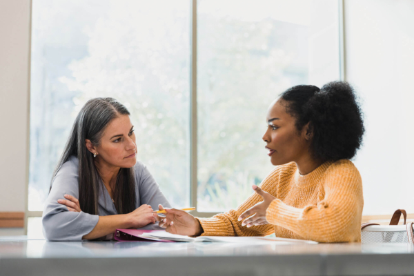 Woman mentoring another woman